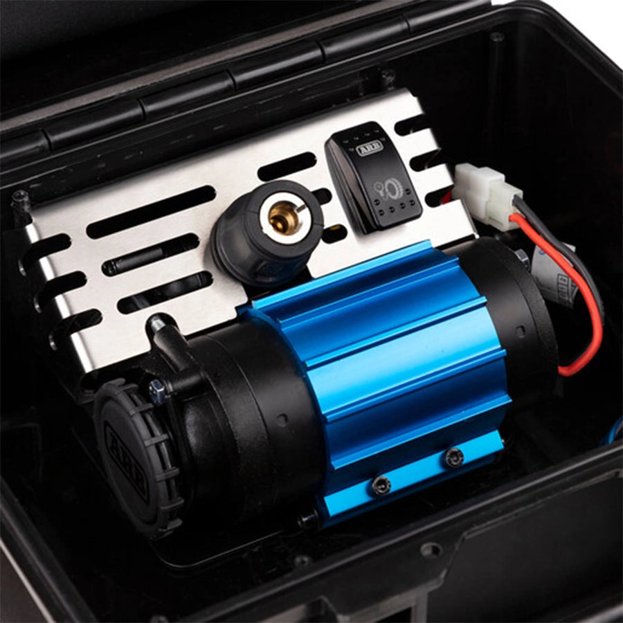 Blue and black mechanical device inside a black toolbox