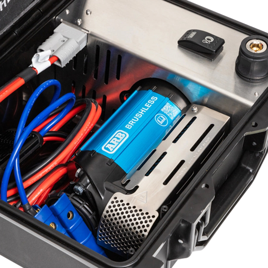 Close-up of a AirCompressorBrushlessSinglePortable12V  with wiring inside a device, featuring the ARB brand.