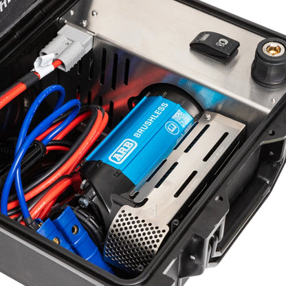 Close-up of a AirCompressorBrushlessSinglePortable12V  with wiring inside a device, featuring the ARB brand.