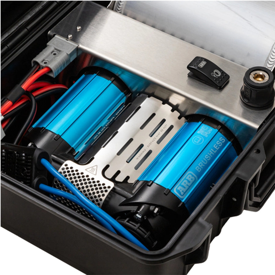 Close-up of a AirCompressorBrushlessTwinPortable12Vwith blue and black parts, likely part of a larger machine or vehicle.