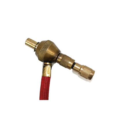 Brass three-way hose connector with red hose on a white background