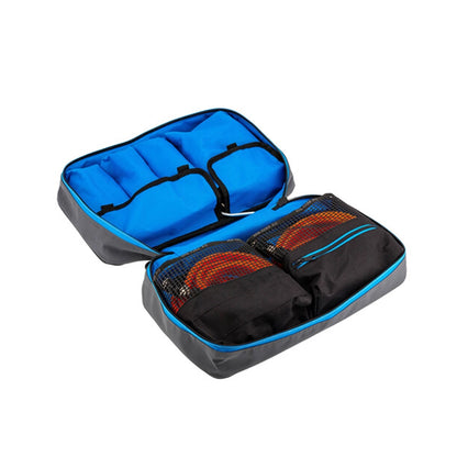 Open travel packing cube with blue interior and black exterior on a white background