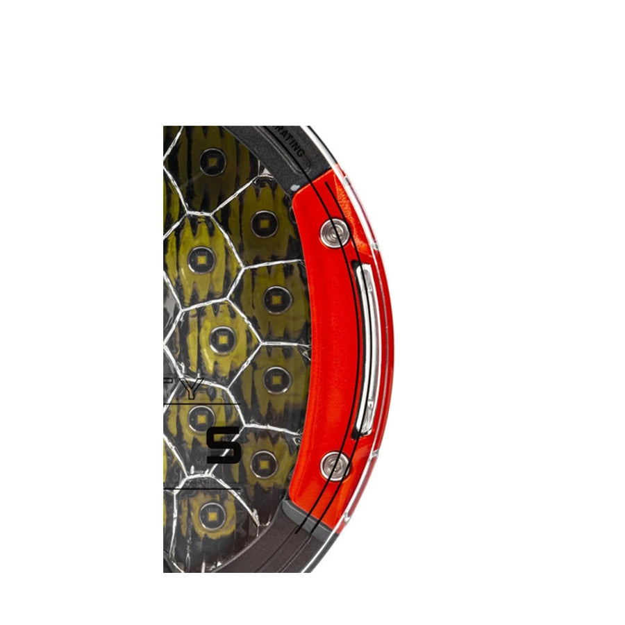 Close-up of a knife handle with red and black design on a white background