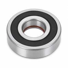 A single metal bearing with a black rubber inner ring and a small brown inner shield, shown on a clean white background.