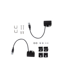 Set of black electronic components and connectors on a white background