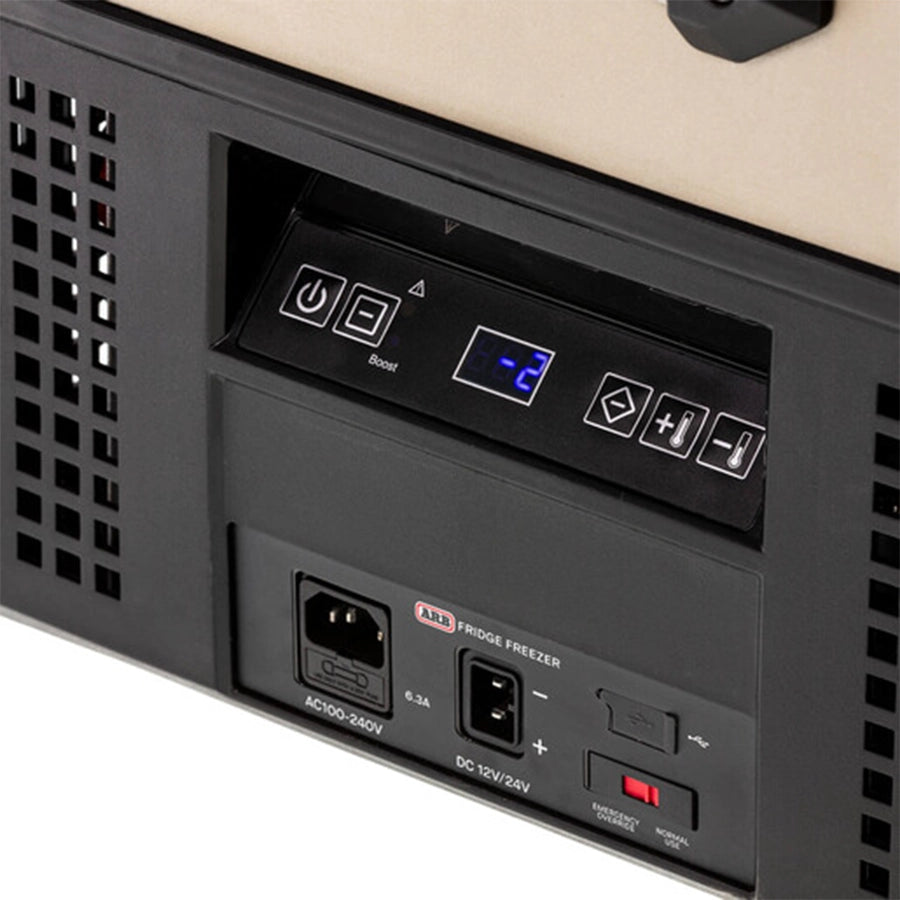 Blurred control panel with buttons and a screen