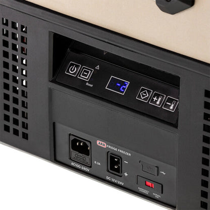 Blurred control panel with buttons and a screen