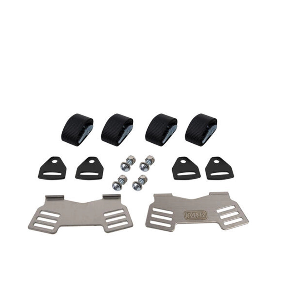 Mechanical parts including metal brackets, black rubber components, and small metal balls on a white background.