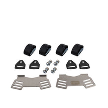 Mechanical parts including metal brackets, black rubber components, and small metal balls on a white background.