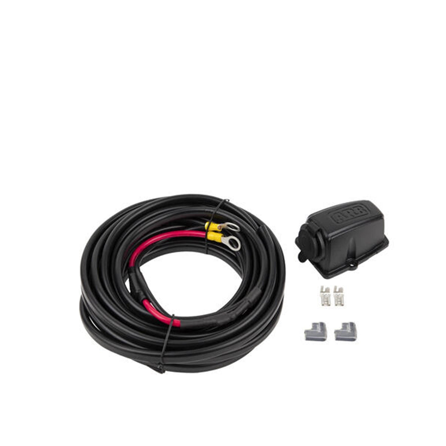 Coiled black cable with connectors on a white background