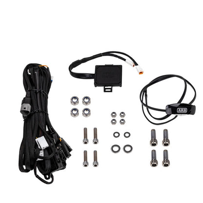 Automotive wiring harness kit with connectors and screws on a white background