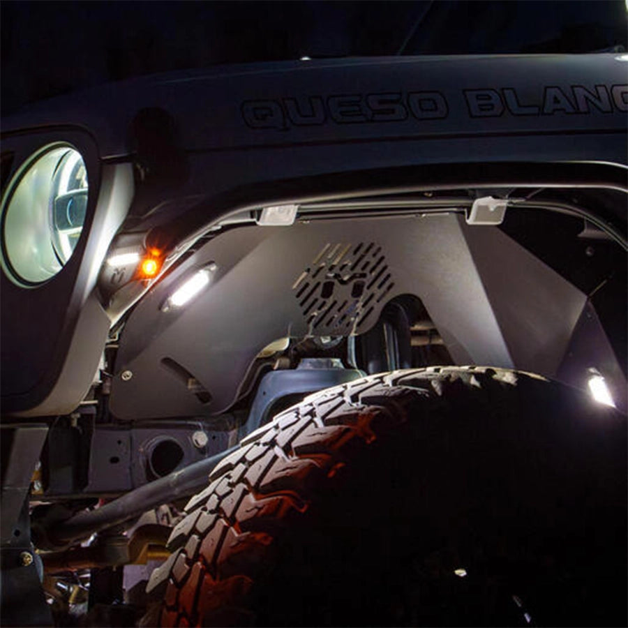 Close-up of a vehicle's front end with 'Queso Blanco' branding.