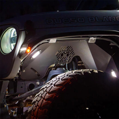 Close-up of a vehicle's front end with 'Queso Blanco' branding.