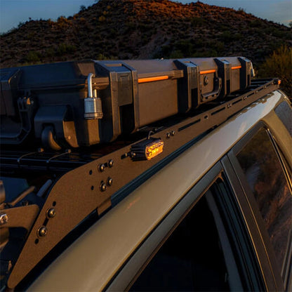 Roof rack system on a vehicle with a desert landscape in the background