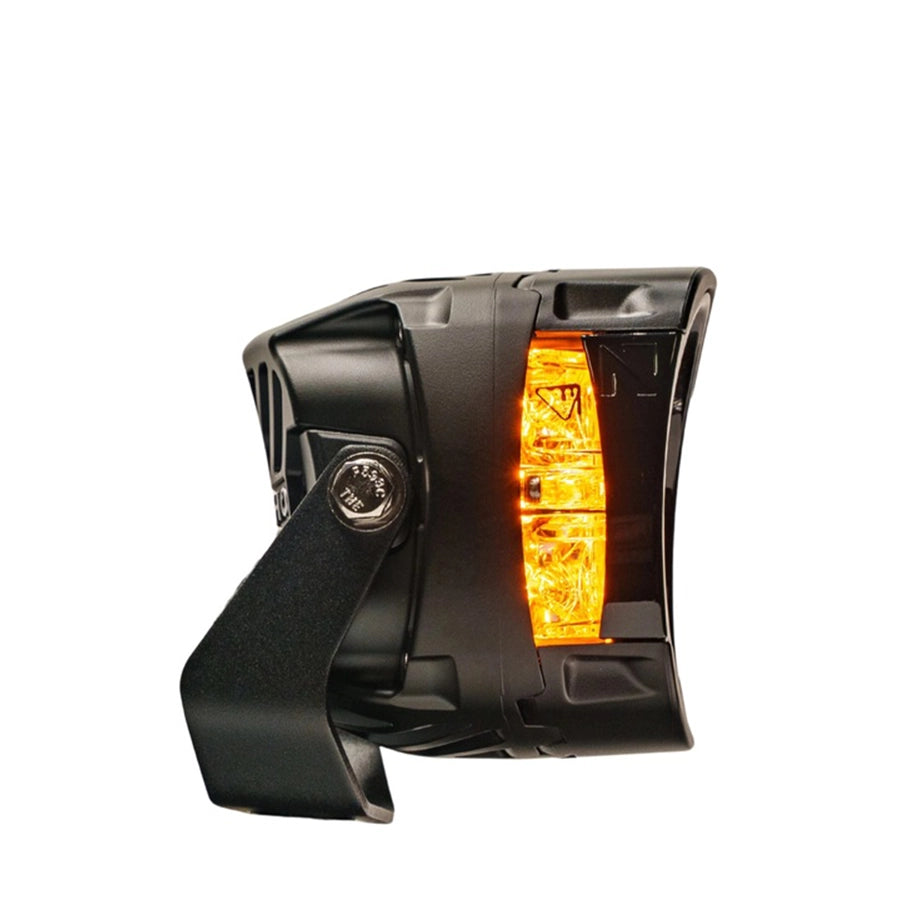 Black motorcycle turn signal with orange indicator on a white background
