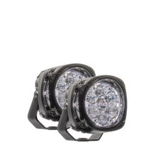 Pair of round LED lights with black housing on a white background